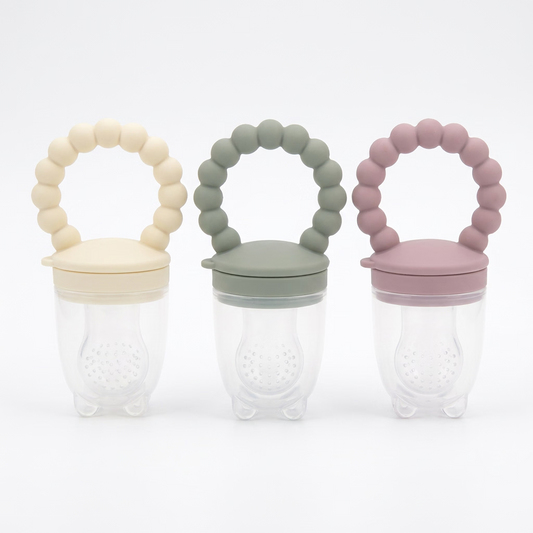 Silicone Baby Food Feeder Set with pastel pink, sage green and pale yellow ring handles and white perforated pouches