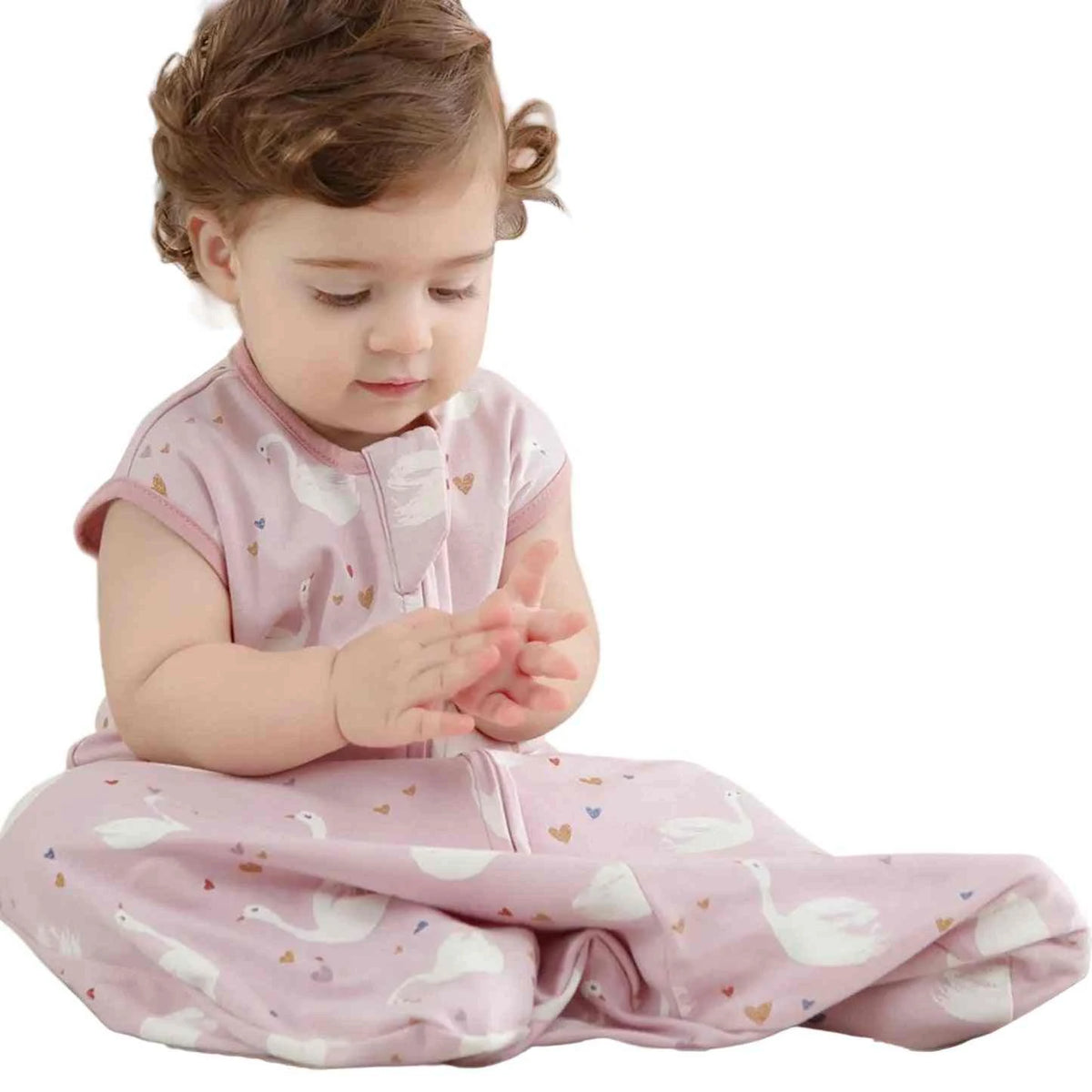 Baby Cotton Sleep Sack in soft pink cotton with a white swan and tiny heart print, sleeveless with a front zipper.
