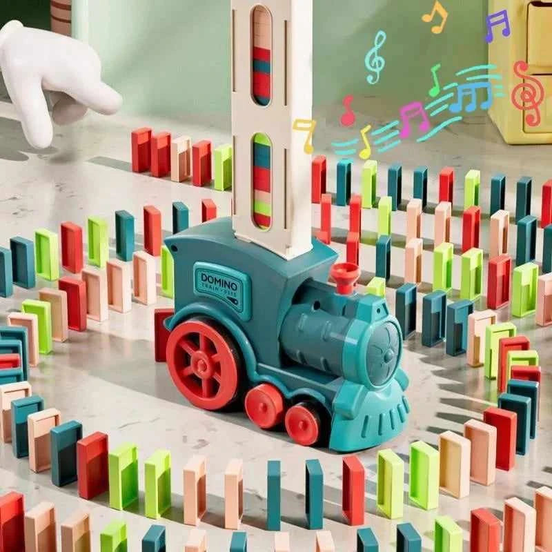 Domino Train Playset with a teal plastic locomotive, red wheels, and upright dominoes in bright assorted colors.