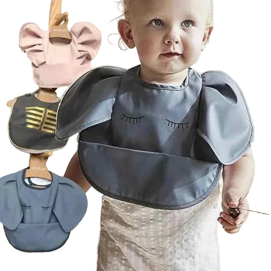 Angel Elephant Baby Bibs in slate blue waterproof fabric, with puffed shoulder sleeves, eyelash print and a wide crumb pocket.