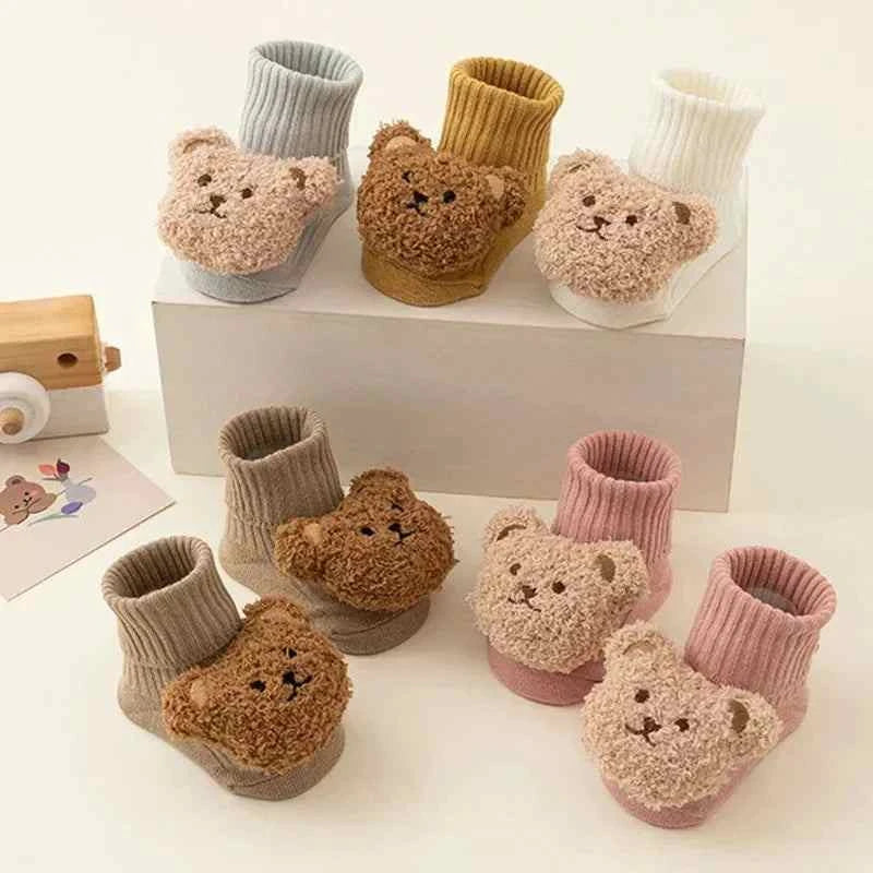 Cartoon Bear Baby Socks in ribbed knit with plush teddy bear faces, shown in cream, mustard, brown, gray, and pink.