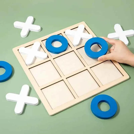 Montessori Tic Tac Toe Game with a pale wood grid board and chunky blue ring and white cross wooden pieces.