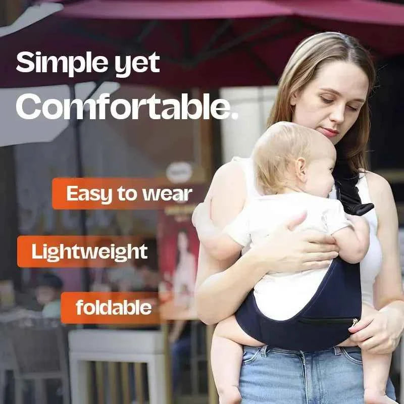 Universal Soft Baby Carrier with a black fabric body, white upper panels, adjustable shoulder straps and a supportive waist band.